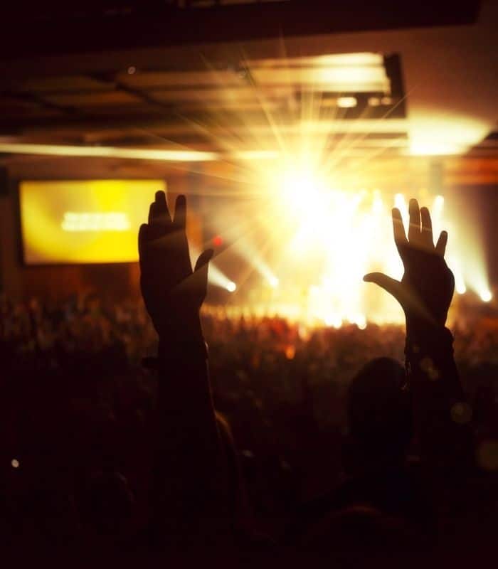 people gathered in a worship hall