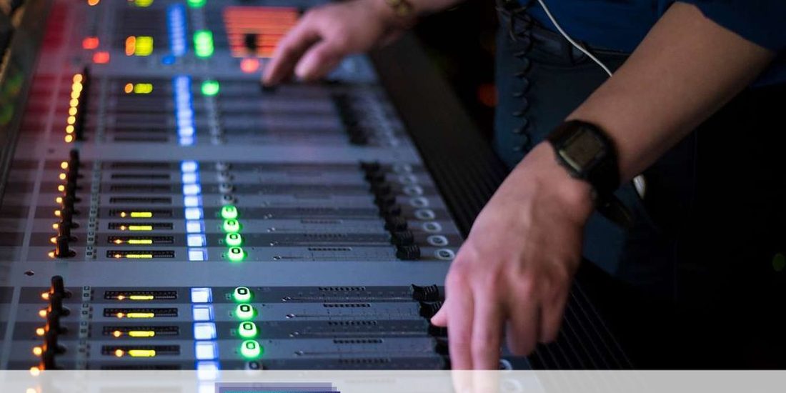 Audio visual technician at a mixing console in Los Angeles